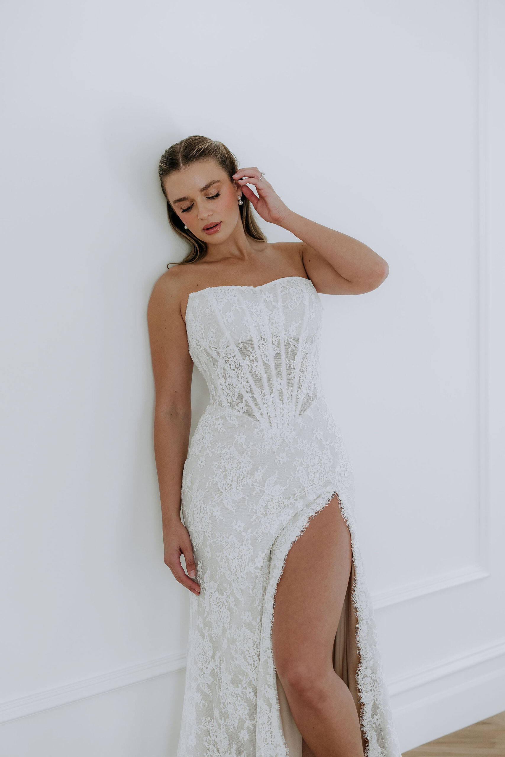 This wedding dress is the essence of love, from the soft illuison bodice to the fishtail shape and detachable half skirt which blooms behind