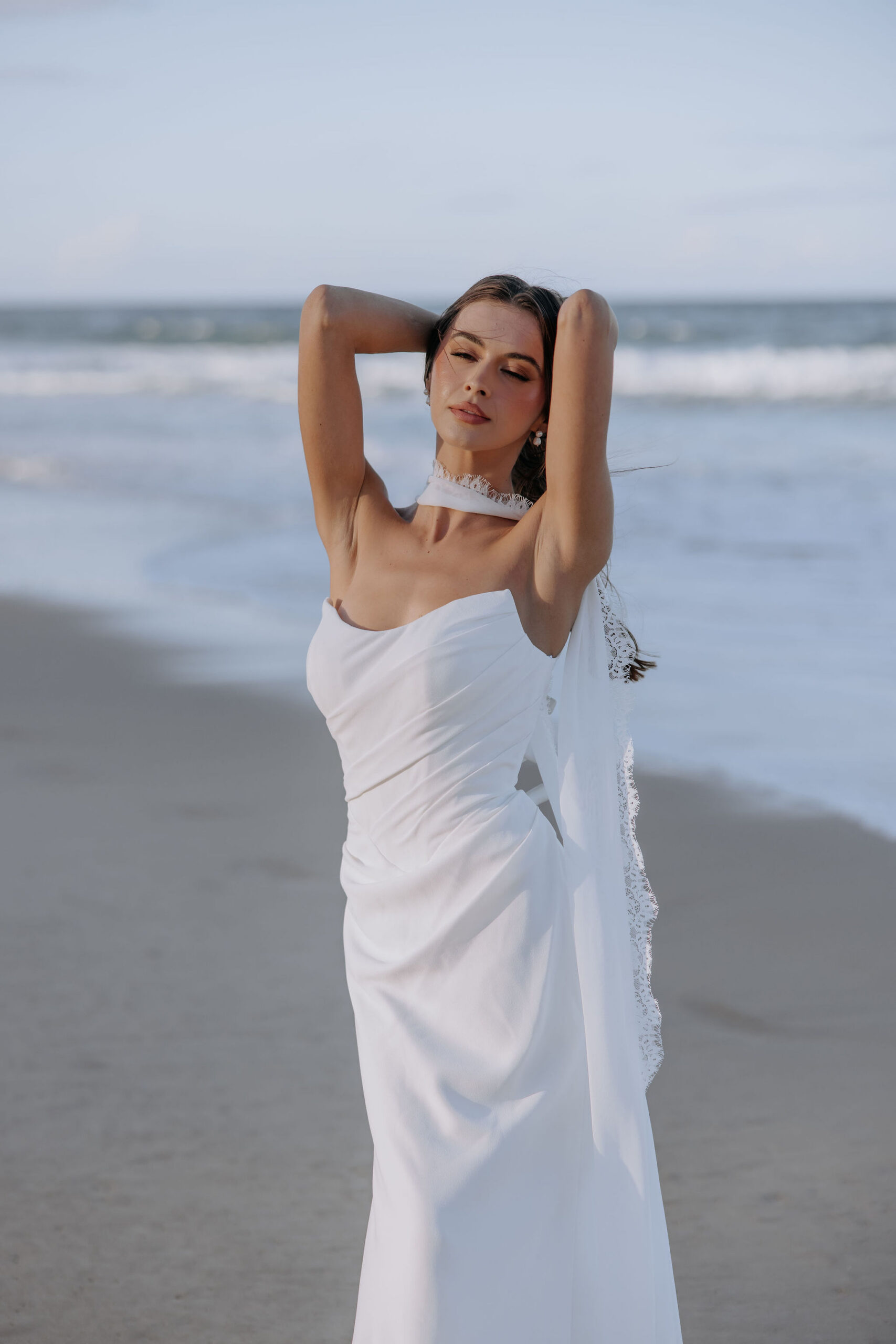 This wedding dress is the essence of love, from the soft illuison bodice to the fishtail shape and detachable half skirt which blooms behind